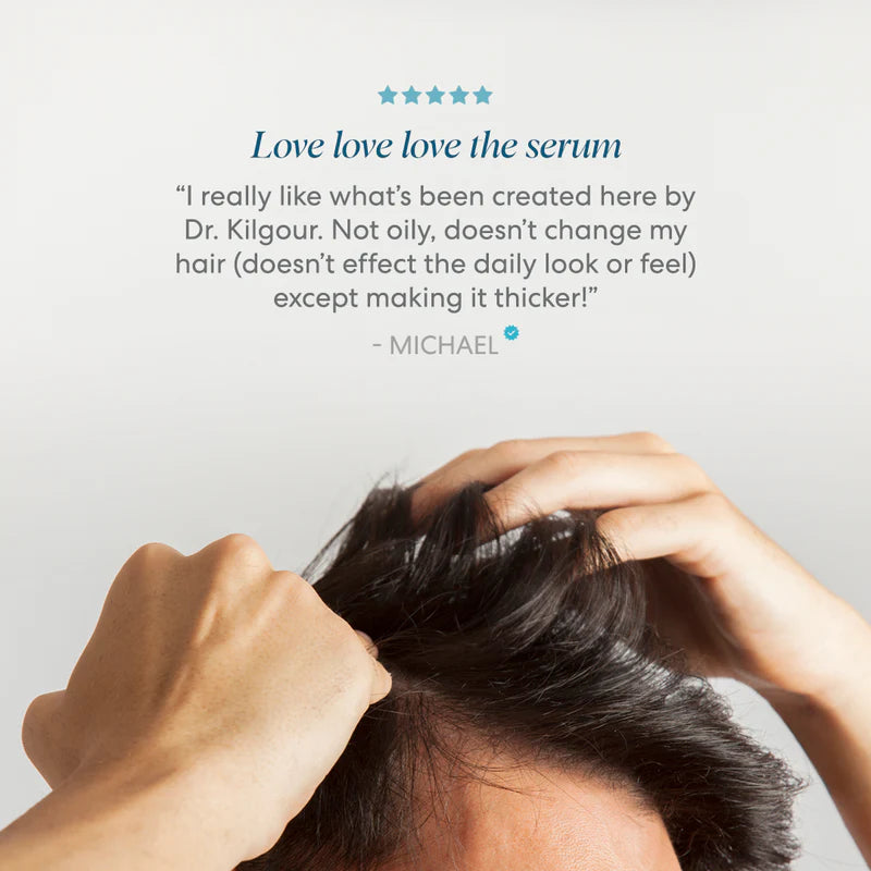 Person touching their hair with text about a hair serum on a light gray background